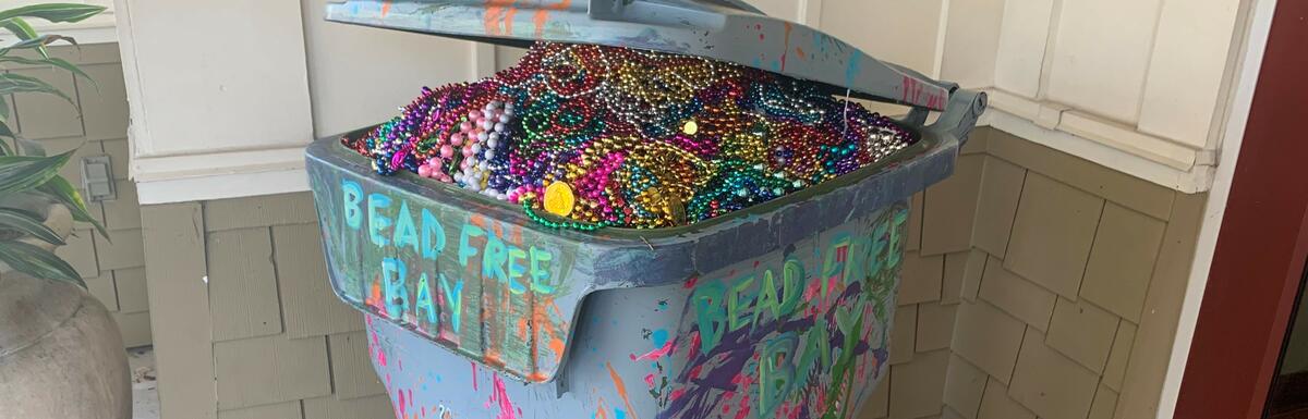 Container overflowing with plastic beads