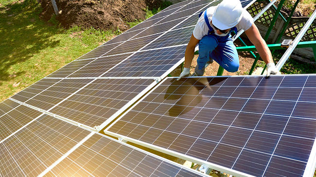 Man installing solar panels