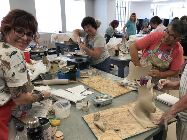 People working on pottery