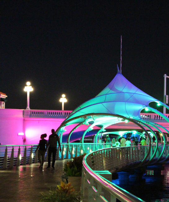 People walking on Riverwalk at night