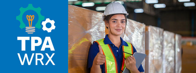 TPA-WRX - Woman with thumb up holding a tablet and wearing hardhat and reflective vest