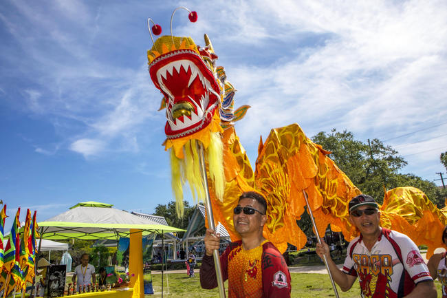 Dragon Dance Performers with blue sky at 2022 Asian American Pacific Islander Festival.