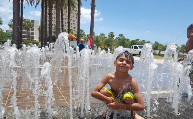 Child in splashpad at Curtis Hixon Waterfront Park